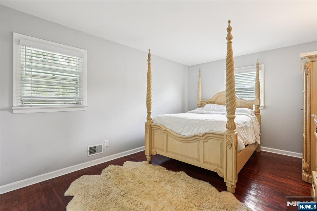 63 Crestmont Road West Orange, NJ 07052 - Photo 18 of 40 a bedroom with a bed and wooden floor