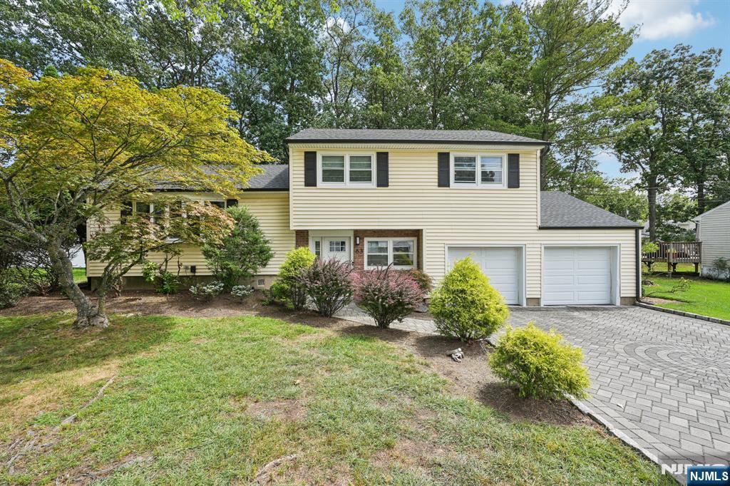 63 Crestmont Road West Orange, NJ 07052 - Photo 2 of 40 a front view of a house with garden