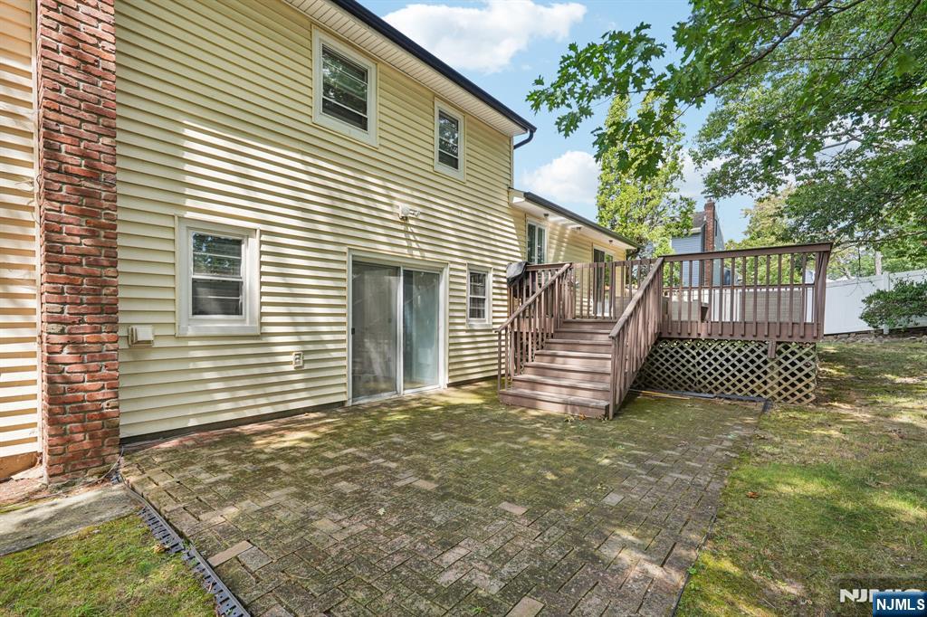 63 Crestmont Road West Orange, NJ 07052 - Photo 34 of 40 a view of a house with a small yard and wooden fence