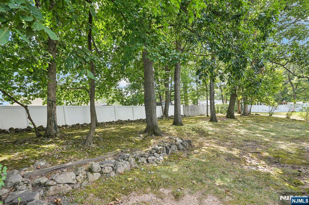 63 Crestmont Road West Orange, NJ 07052 - Photo 38 of 40 a view of a tree in the middle of a yard