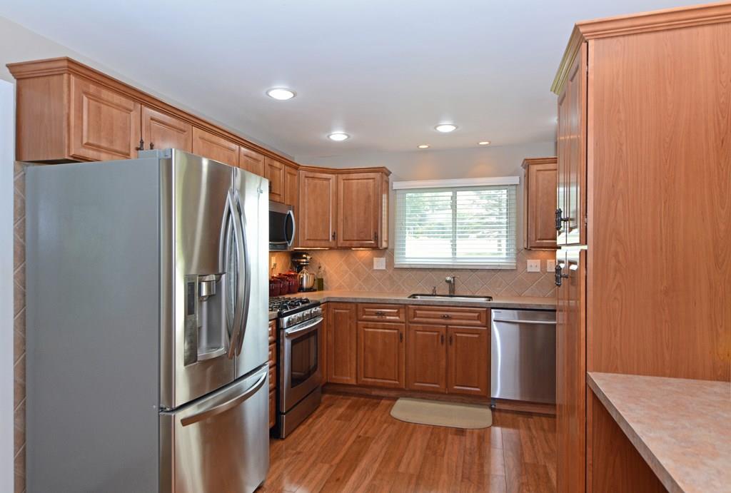 1995 O'Block Road Plum, PA 15239 - Photo 4 of 20 The updated kitchen boasts new cabinetry, stainless steel appliances (dishwasher, microwave, range,refrigerator), new countertops, recessed and under-cabinet lighting, a large built-in pantry with rollout drawers, and a large prep counter that doubles as the perfect buffet area for entertaining.