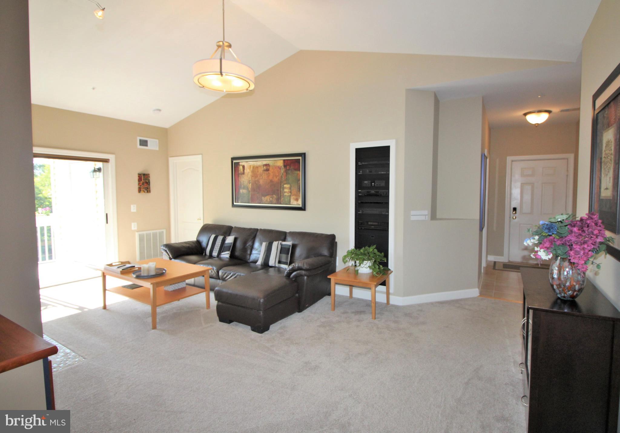 20901 Cedarpost Square, Unit 301 Ashburn, VA 20147 - Photo 6 of 25 Living Room - view from dining