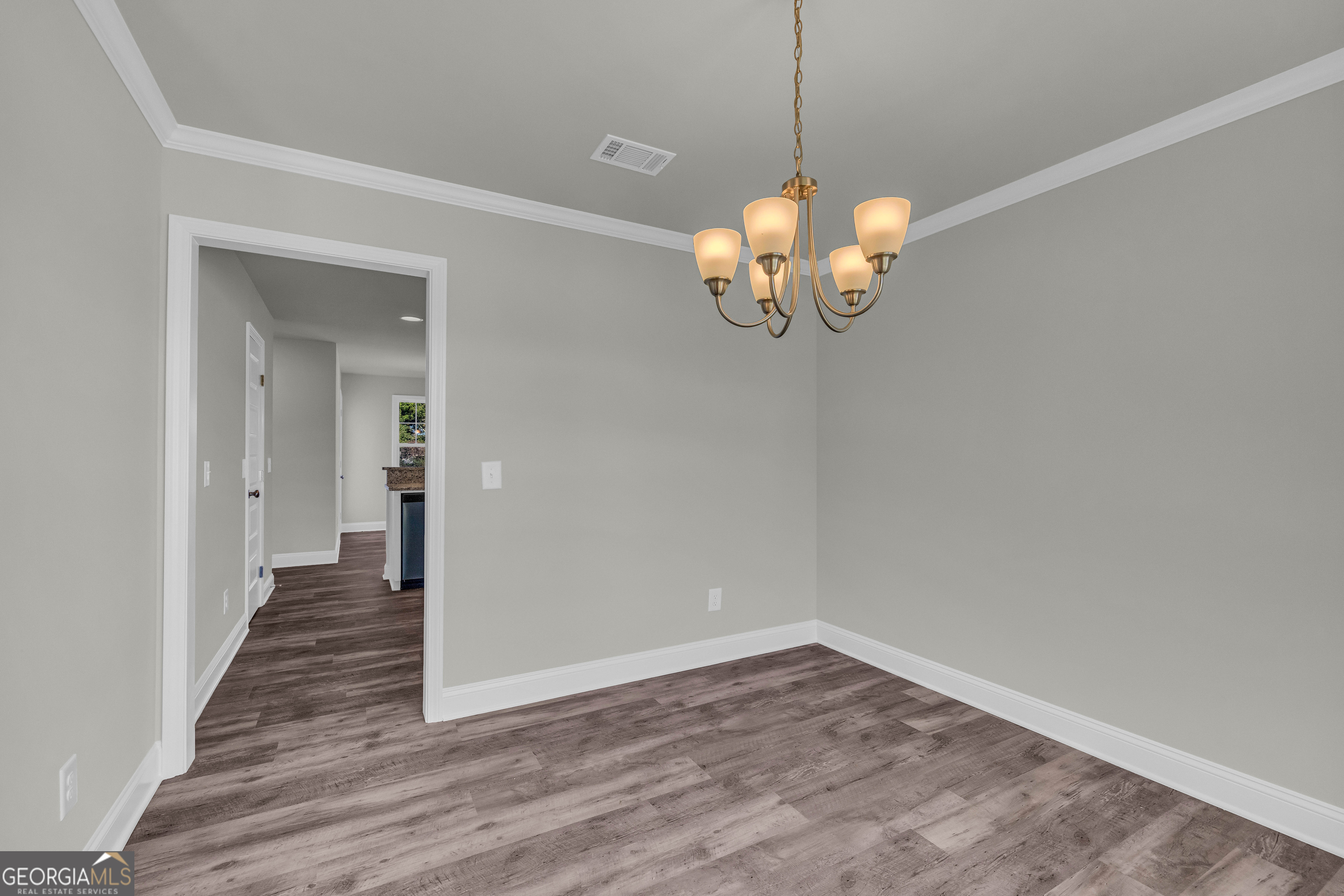 62 Sewell Road Lavonia, GA 30553 - Photo 21 of 63 a view of a room with wooden floor and chandelier