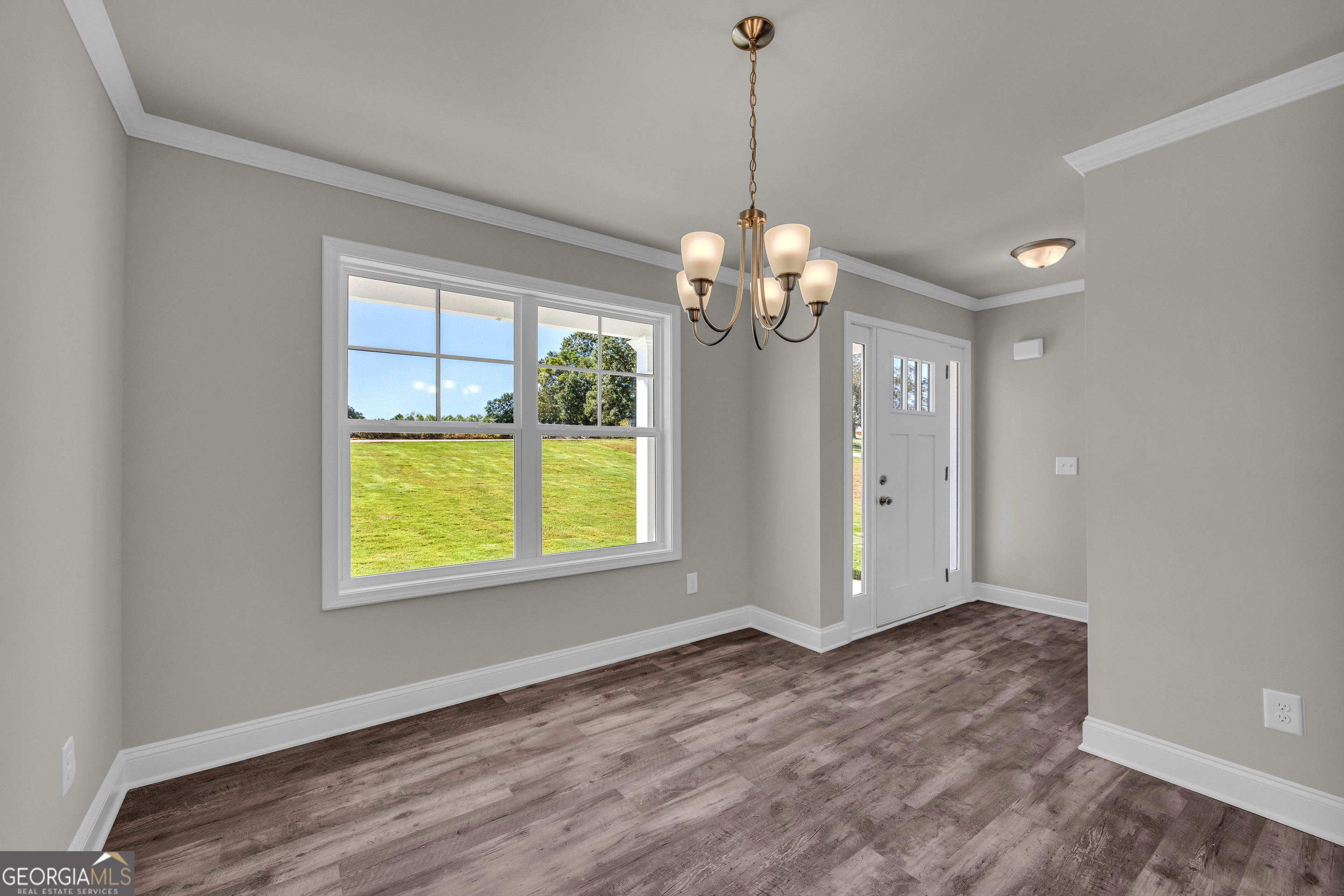 62 Sewell Road Lavonia, GA 30553 - Photo 23 of 63 a view of an empty room with a window and a kitchen view
