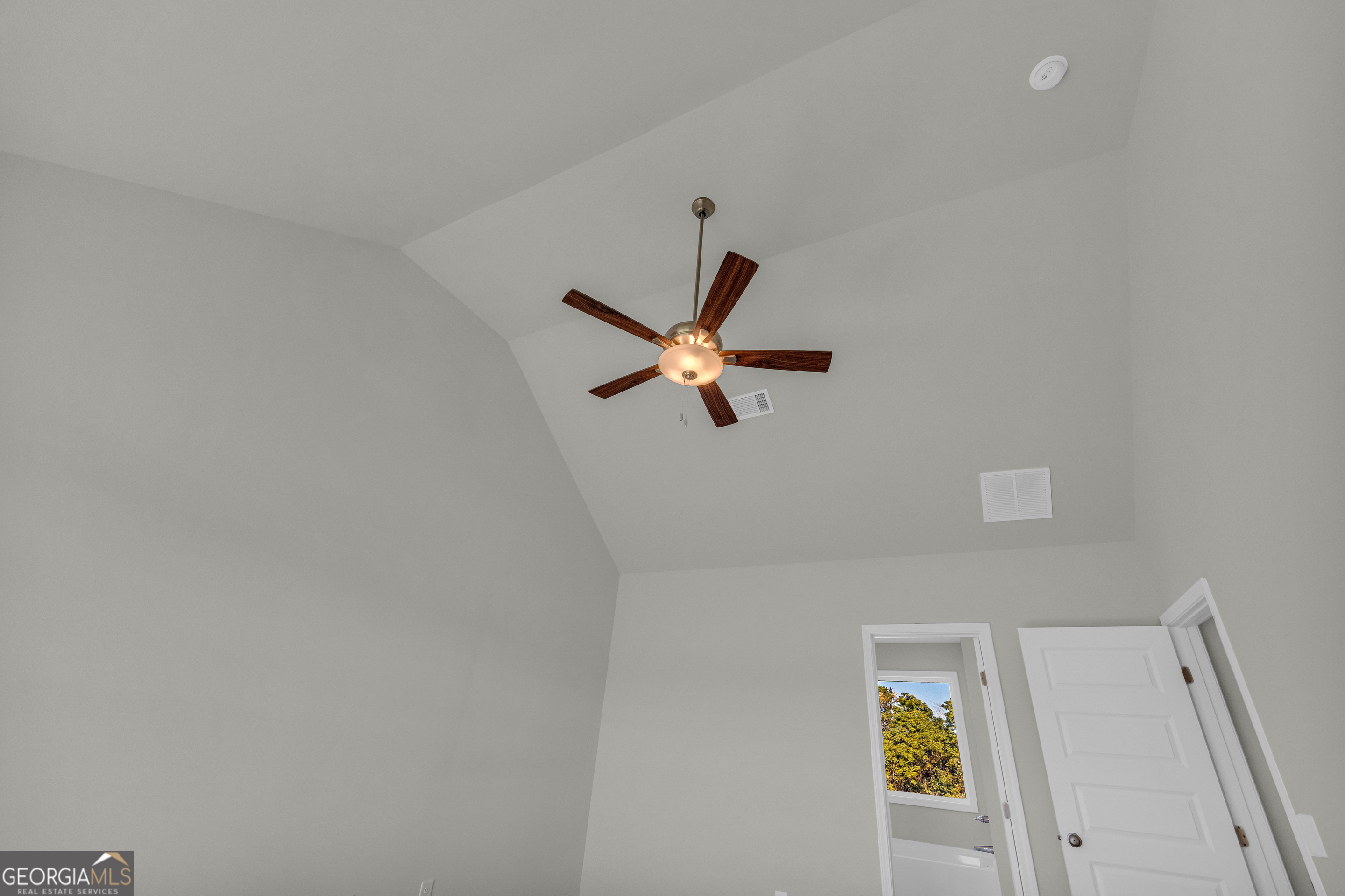 62 Sewell Road Lavonia, GA 30553 - Photo 31 of 63 a work place with a window and a ceiling fan