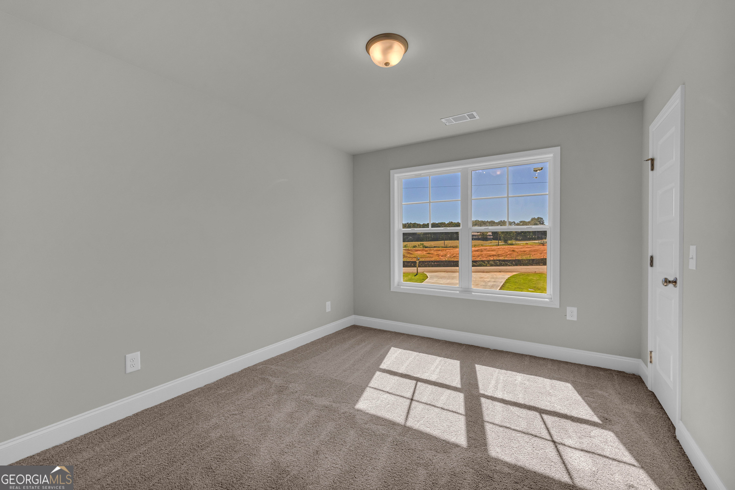 62 Sewell Road Lavonia, GA 30553 - Photo 42 of 63 a view of an empty room with a window