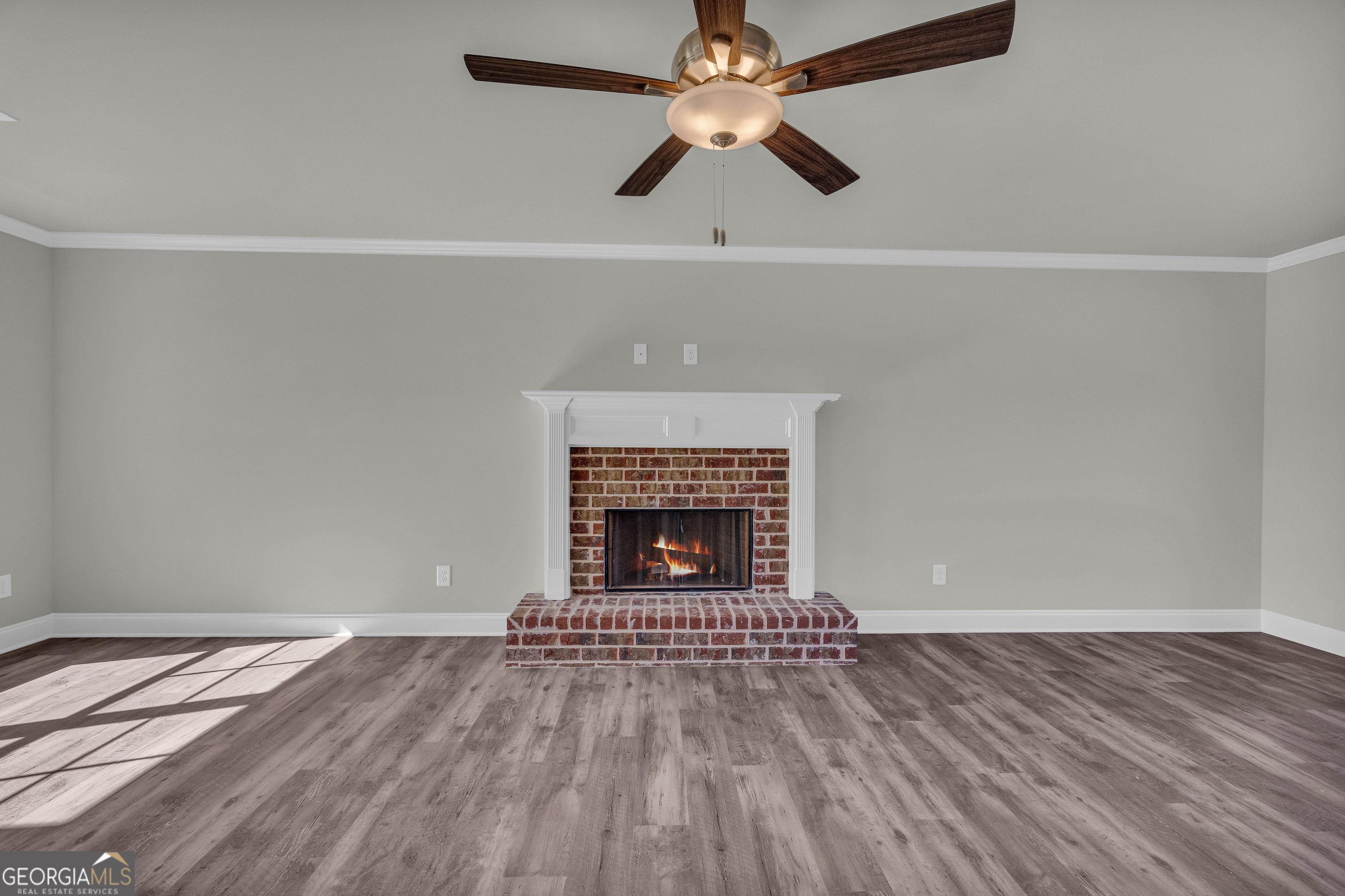 62 Sewell Road Lavonia, GA 30553 - Photo 6 of 63 wooden floor in an empty room with a fireplace