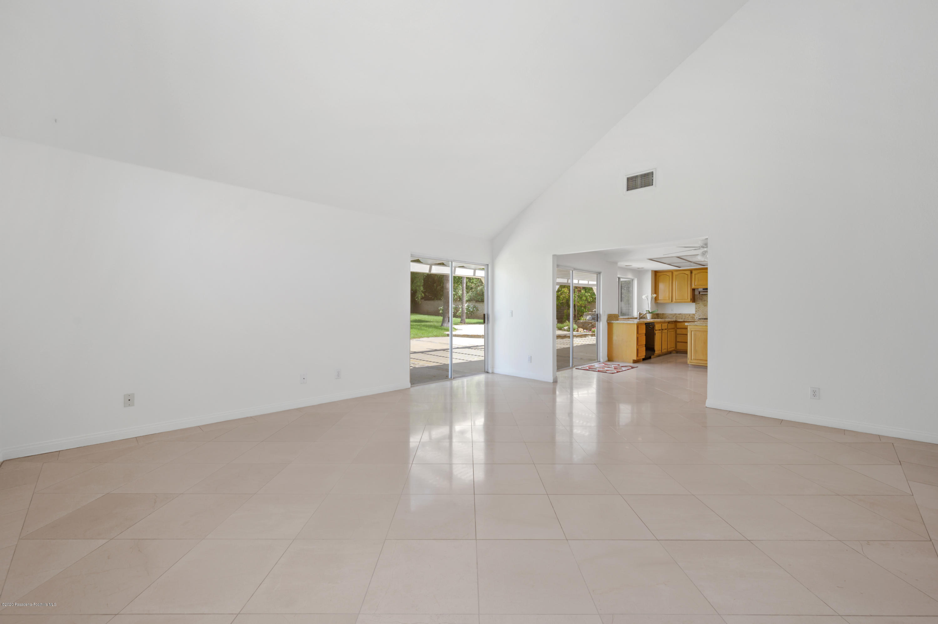 10652 Rathburn Avenue Porter Ranch, CA 91326 - Photo 14 of 61 wooden floor in an empty room with a window