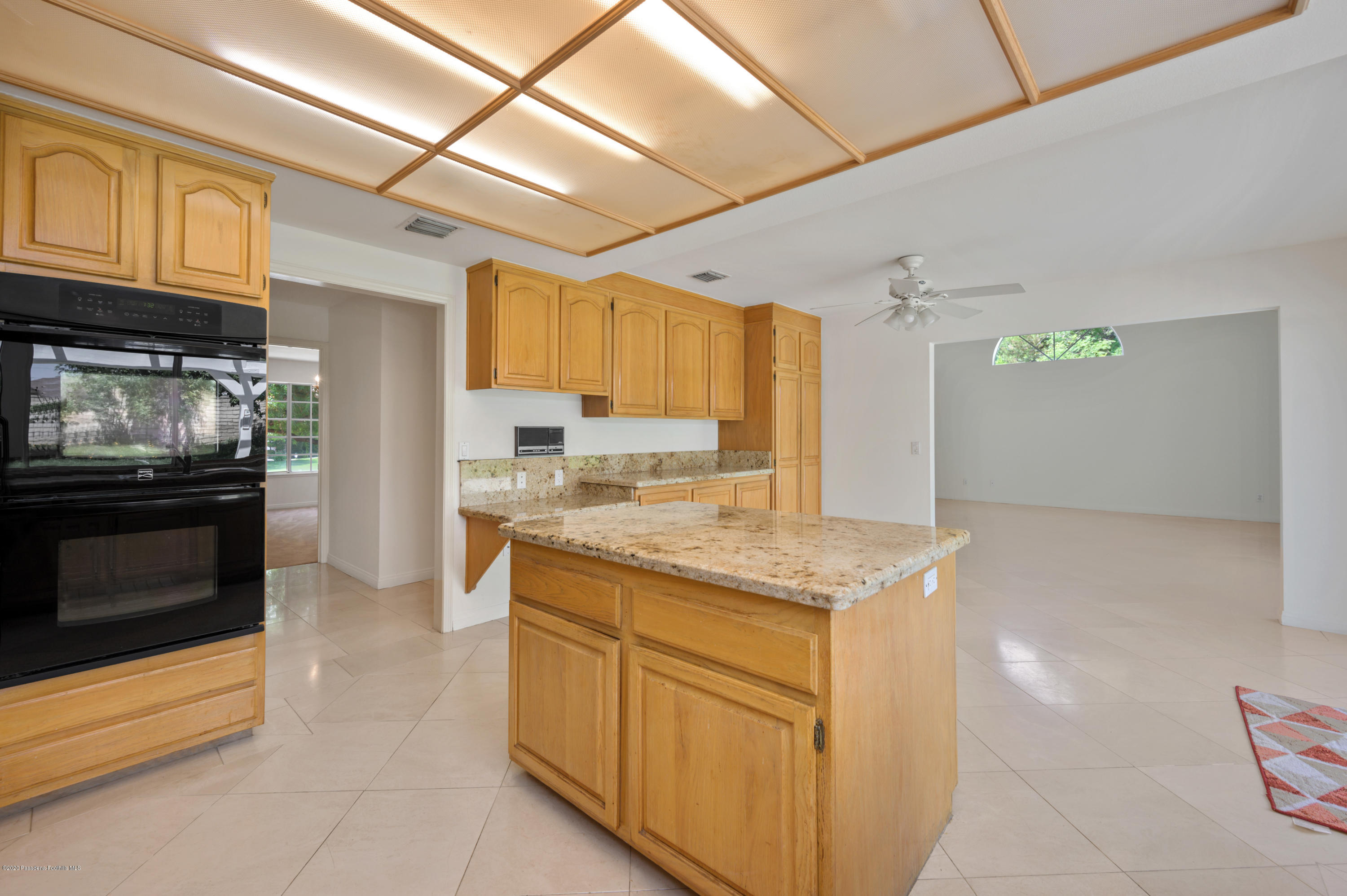 10652 Rathburn Avenue Porter Ranch, CA 91326 - Photo 19 of 61 a kitchen with stainless steel appliances granite countertop a sink and cabinets