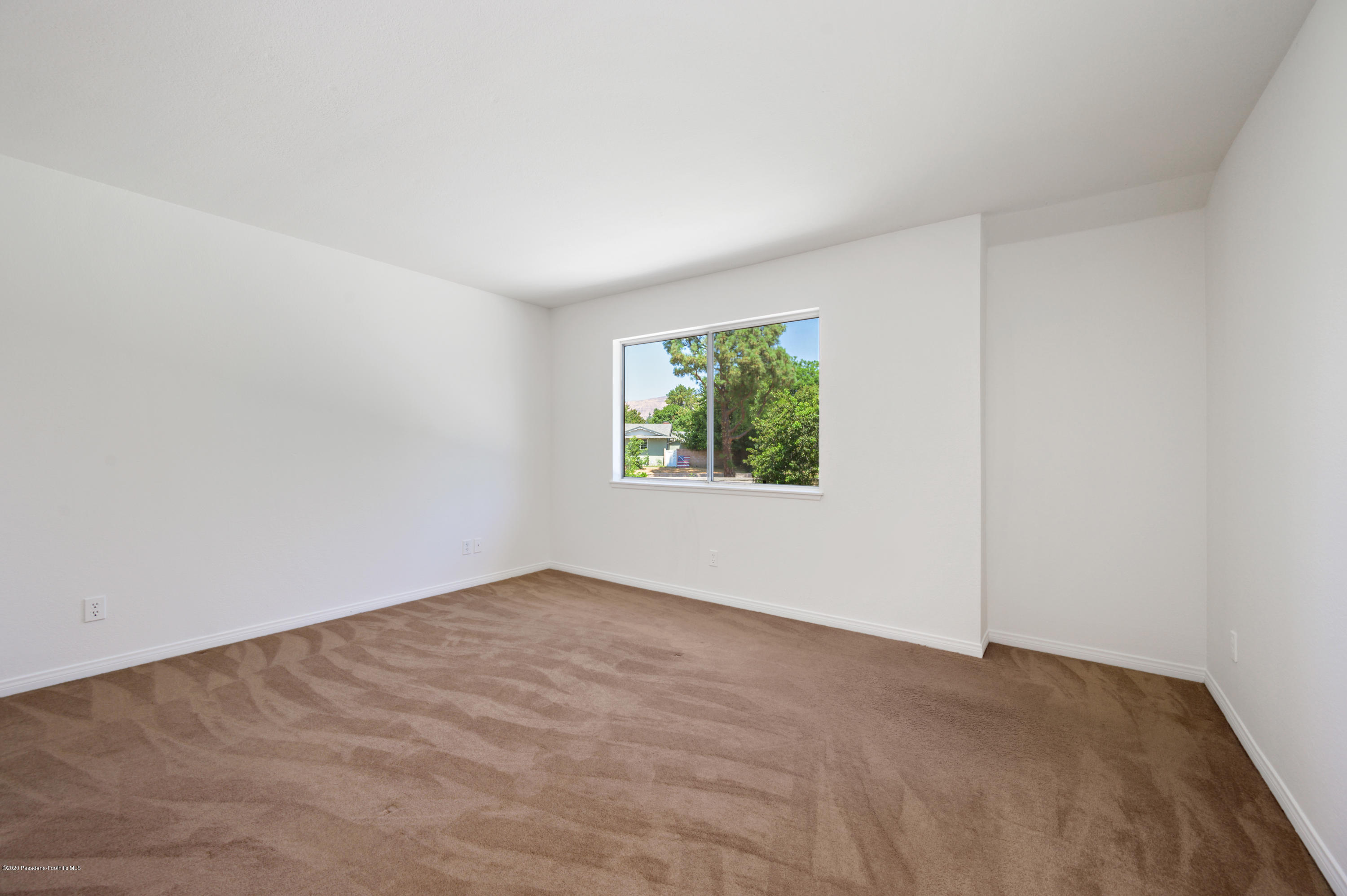 10652 Rathburn Avenue Porter Ranch, CA 91326 - Photo 21 of 61 an empty room with windows