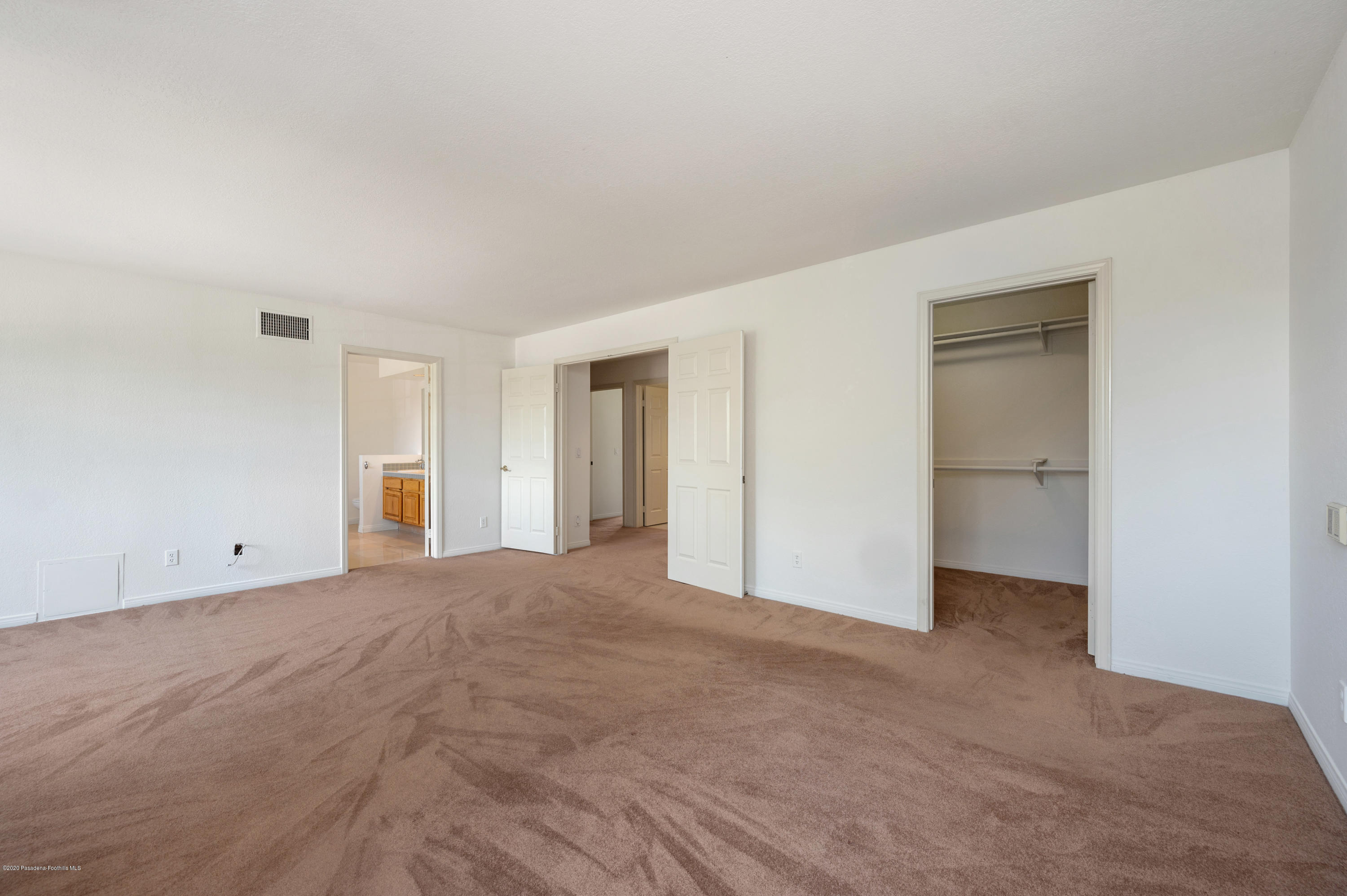 10652 Rathburn Avenue Porter Ranch, CA 91326 - Photo 27 of 61 a view of an empty room with closet and entryway