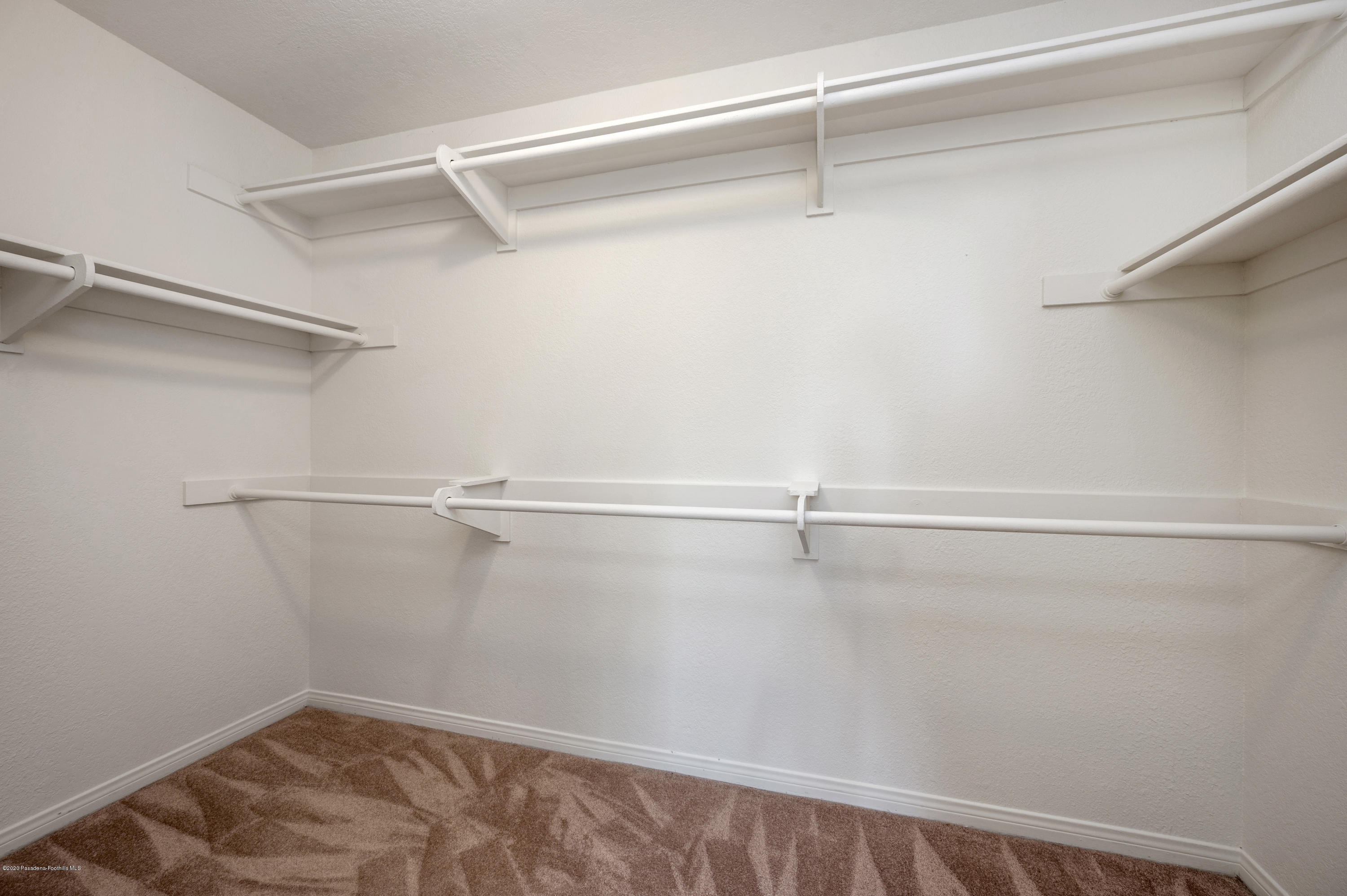 10652 Rathburn Avenue Porter Ranch, CA 91326 - Photo 28 of 61 a view of a room with racks on the wall
