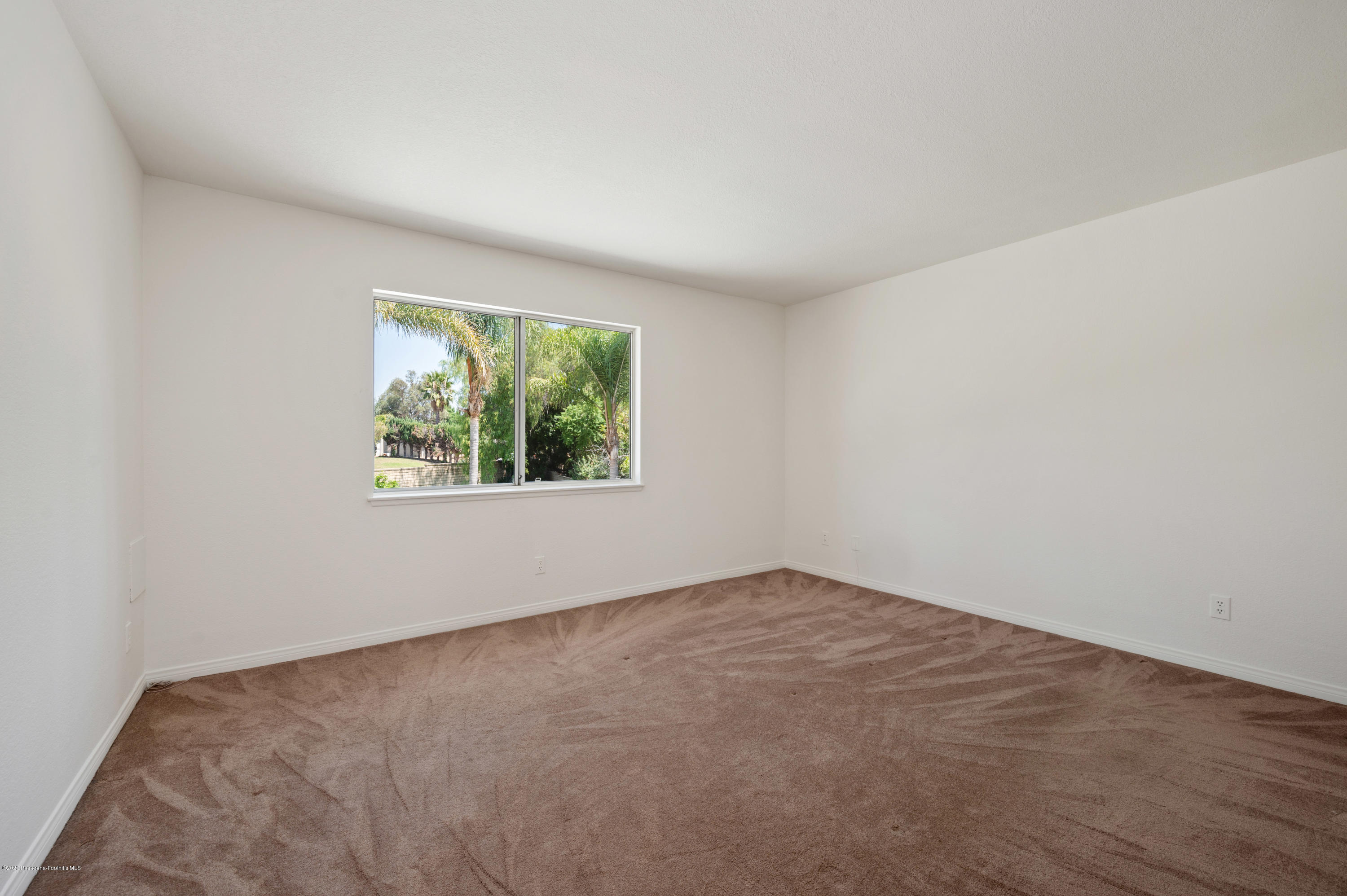 10652 Rathburn Avenue Porter Ranch, CA 91326 - Photo 33 of 61 an empty room with a window