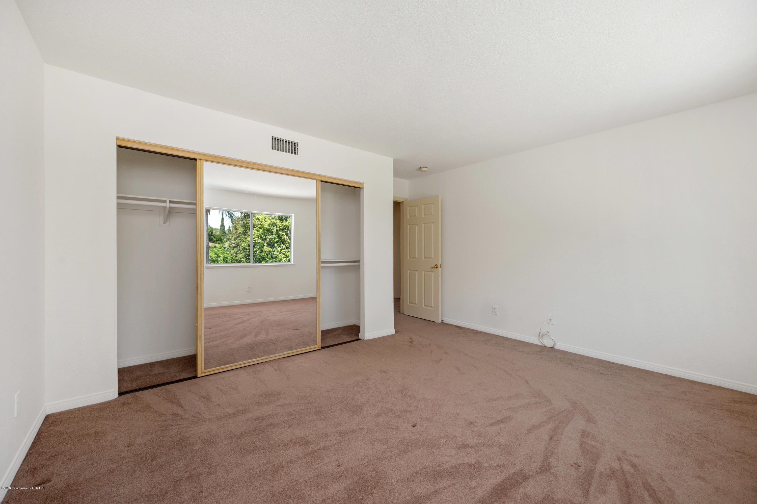 10652 Rathburn Avenue Porter Ranch, CA 91326 - Photo 34 of 61 a view of an empty room with a window