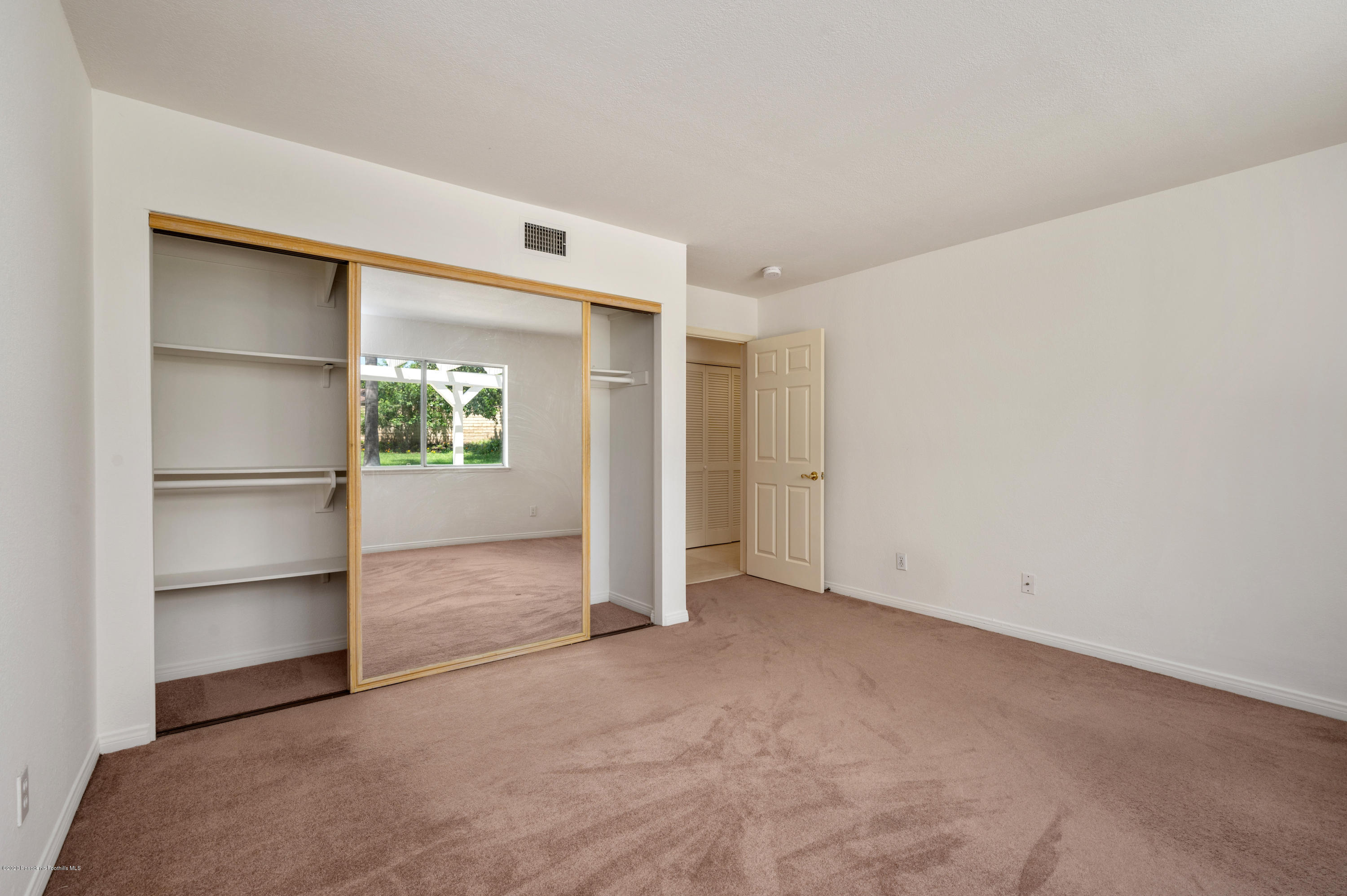 10652 Rathburn Avenue Porter Ranch, CA 91326 - Photo 38 of 61 a view of an empty room and a cabinet