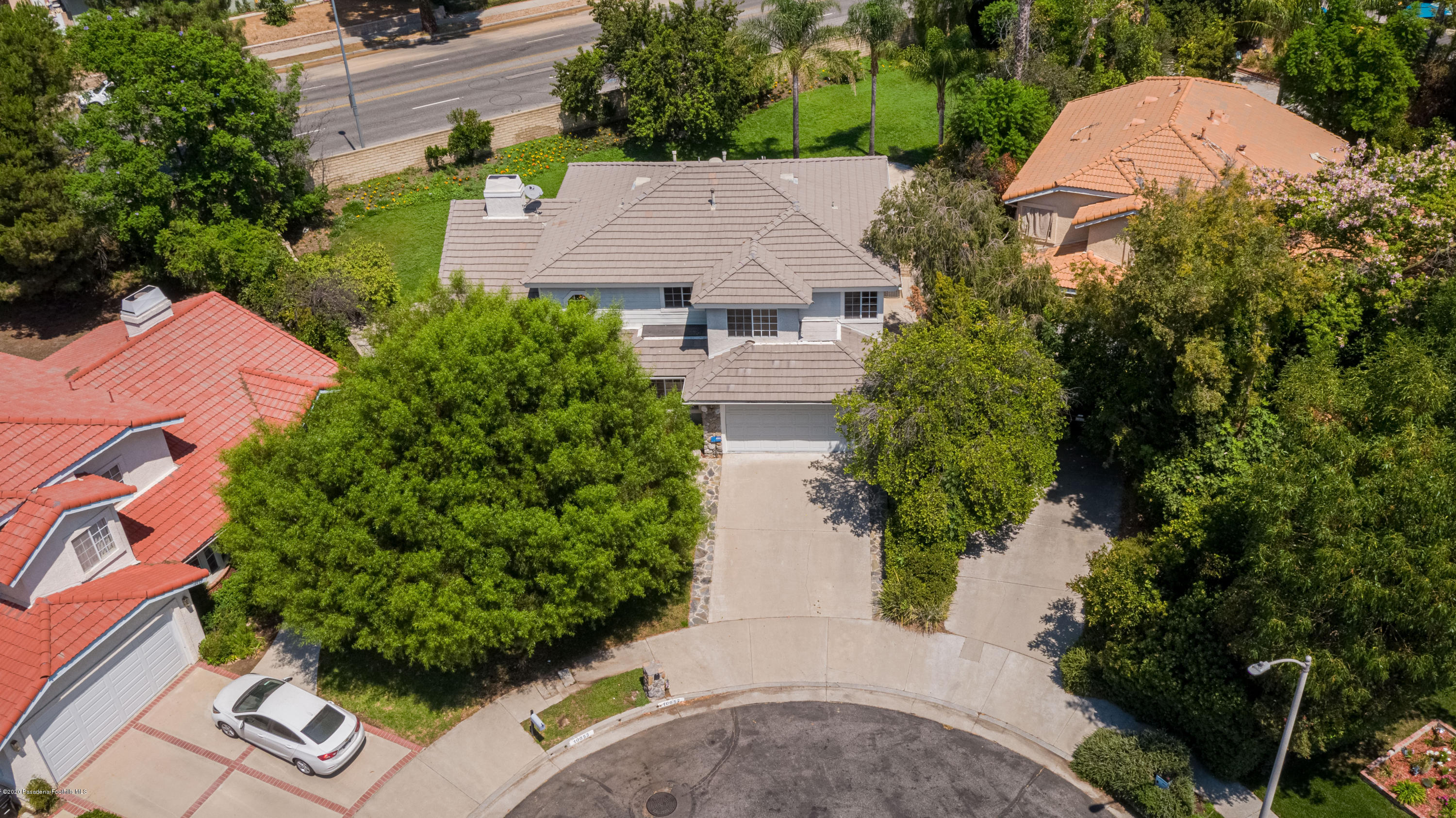 10652 Rathburn Avenue Porter Ranch, CA 91326 - Photo 58 of 61 an aerial view of a house with garden space and street view