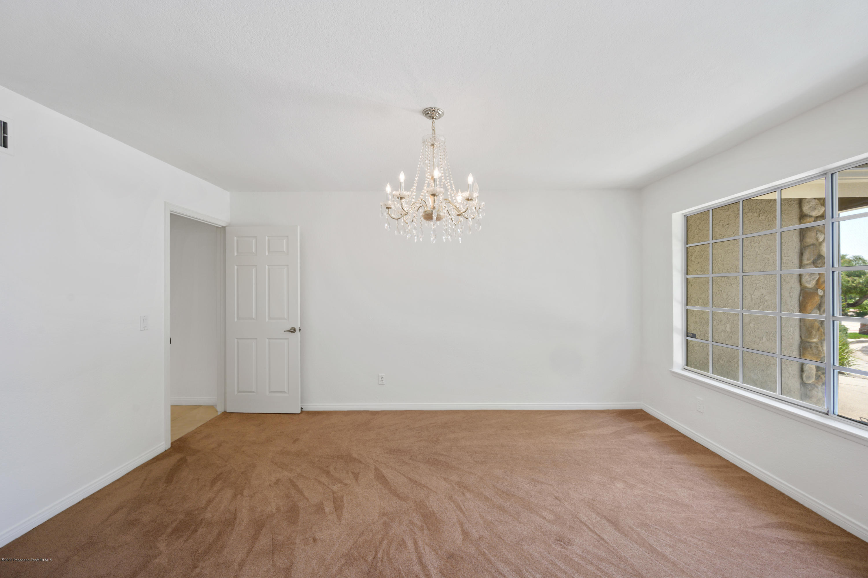 10652 Rathburn Avenue Porter Ranch, CA 91326 - Photo 10 of 61 a view of an empty room with a window