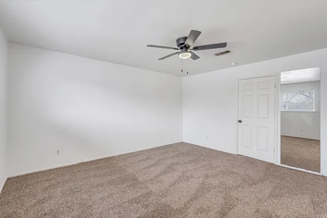 a view of a big room with carpet