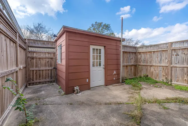 a backyard of a house with sofas