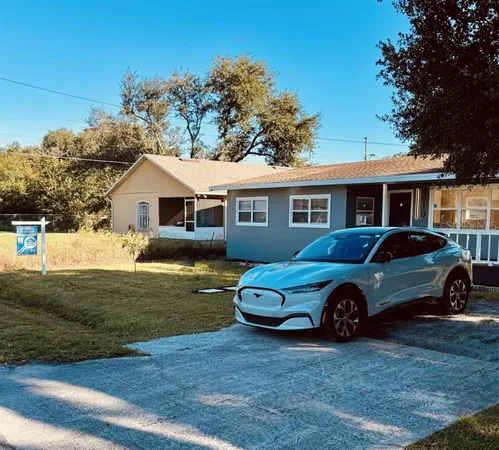 a car parked in front of a house