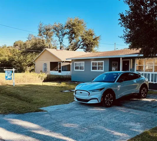 a car parked in front of a house