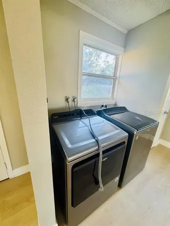 a utility room with dryer and washer
