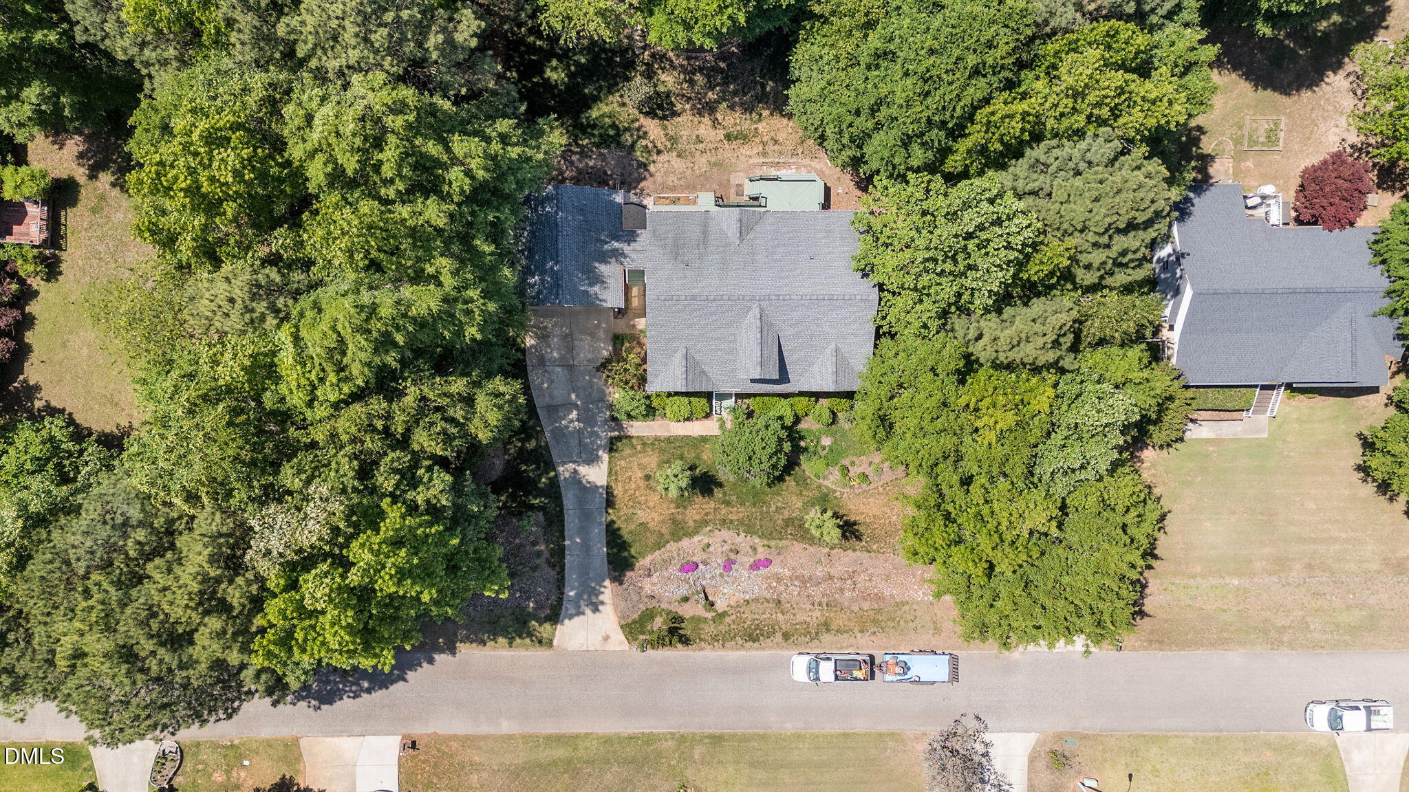 6820 Oviedo Drive Raleigh, NC 27603 - Photo 44 of 50 an aerial view of a house with a yard and large trees