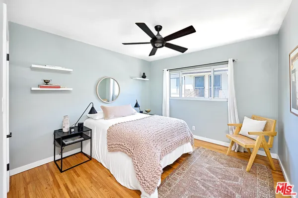 a bed room with a bed and a window
