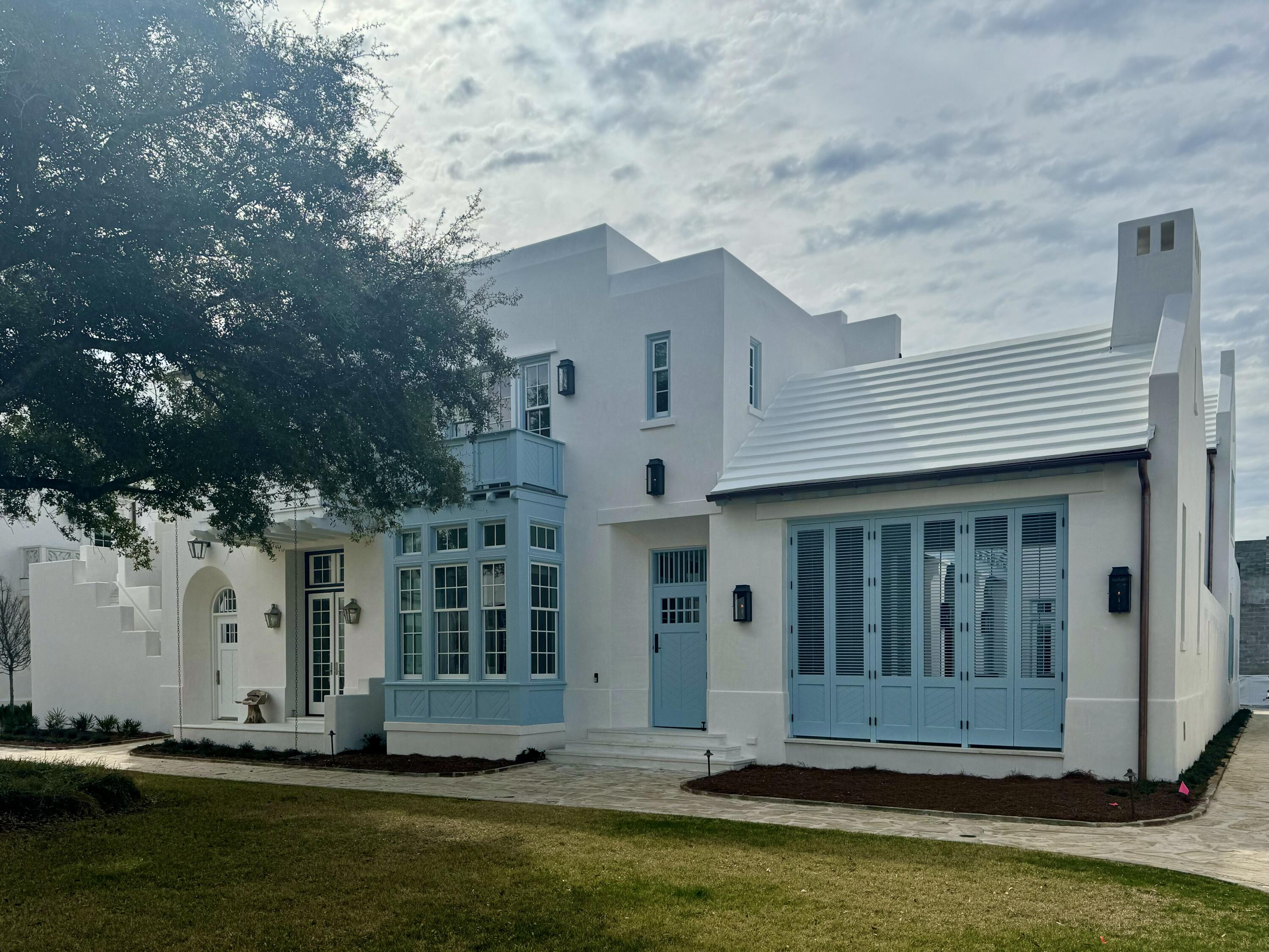 48 Smugglers Alley, Unit CC16 Inlet Beach, FL 32461 - Photo 1 of 16 a front view of a house with a small yard