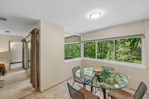 a view of a livingroom with furniture and window