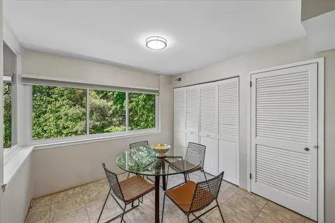 a view of a livingroom with furniture and a window