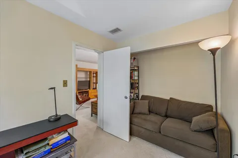 a living room with furniture and a rug