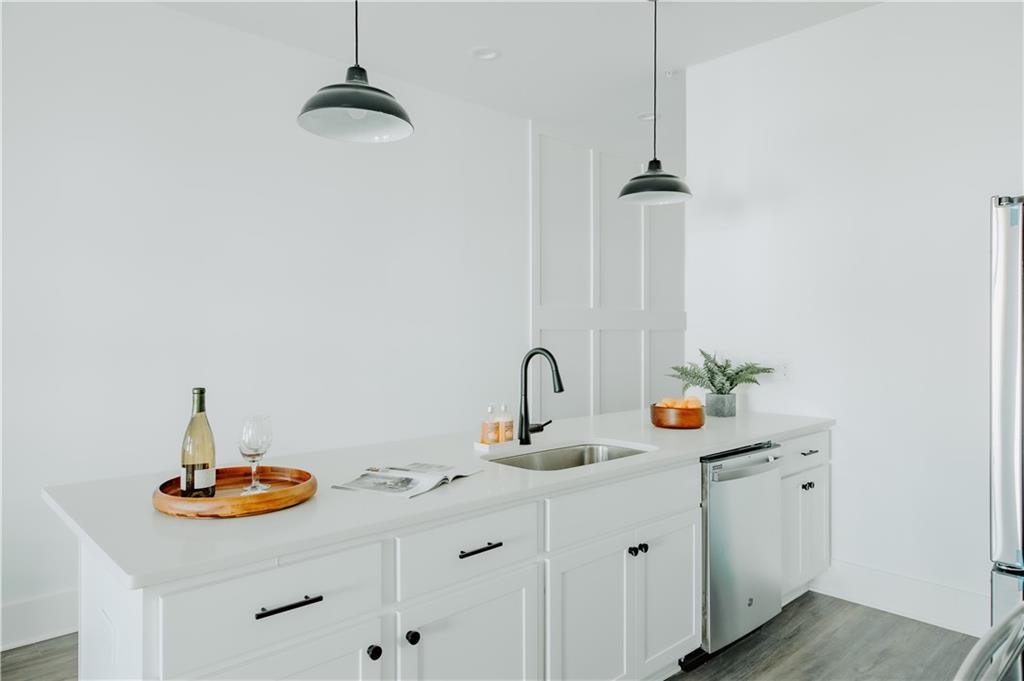 117 Mayson Avenue Northeast, Unit C Atlanta, GA 30307 - Photo 16 of 30 a bathroom with a sink and a mirror