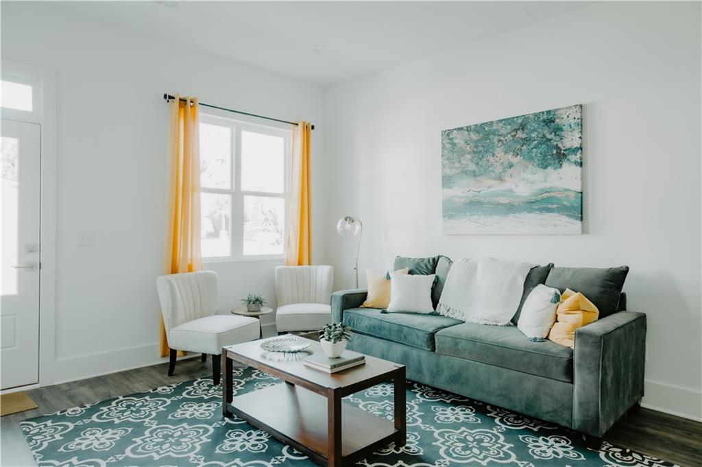 117 Mayson Avenue Northeast, Unit C Atlanta, GA 30307 - Photo 18 of 30 a living room with furniture and a window