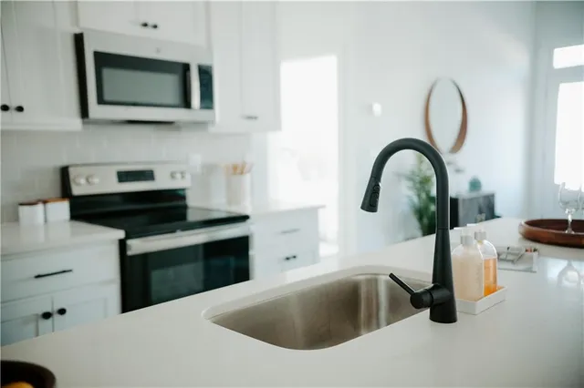 a bathroom with a double vanity sink and mirror