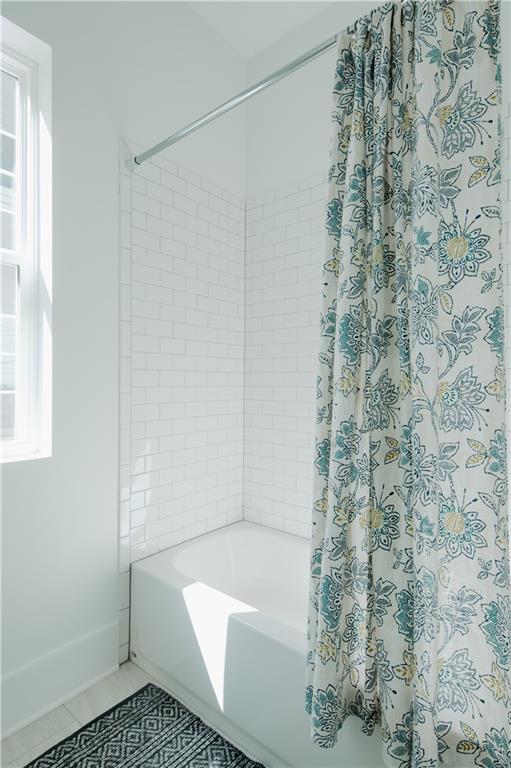 117 Mayson Avenue Northeast, Unit C Atlanta, GA 30307 - Photo 10 of 30 a bathroom with a bathtub and shower