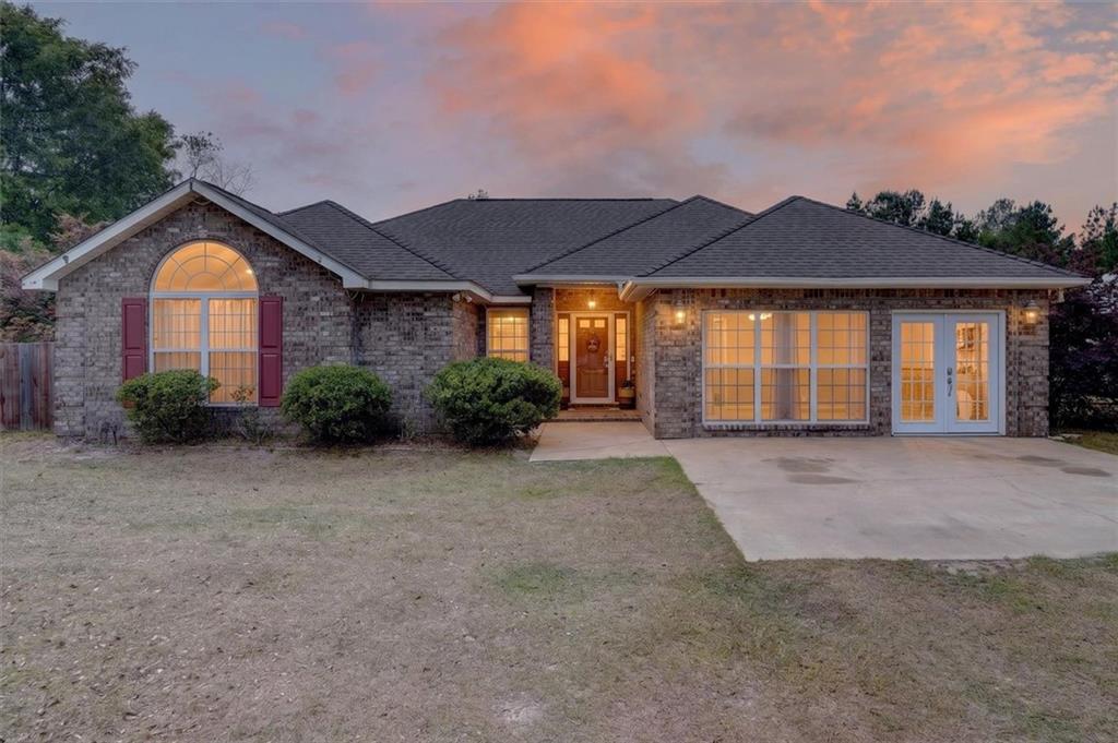 359 Poole Road Ludowici, GA 31316 - Photo 1 of 49 a view of a house with a yard and potted plants
