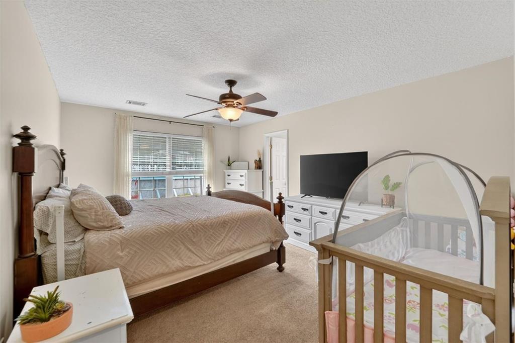 359 Poole Road Ludowici, GA 31316 - Photo 17 of 49 a bedroom with a bed and a flat screen tv