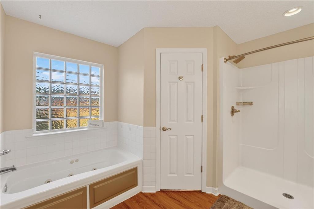 359 Poole Road Ludowici, GA 31316 - Photo 19 of 49 a bathroom with a bathtub and a shower
