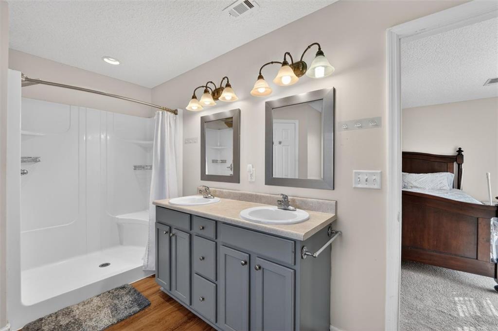 359 Poole Road Ludowici, GA 31316 - Photo 20 of 49 a bathroom with a tub sink and mirror