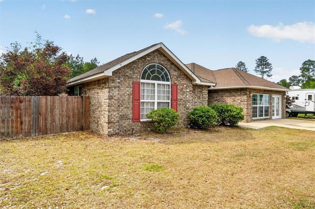 359 Poole Road Ludowici, GA 31316 - Photo 2 of 49 a front view of a house with a yard