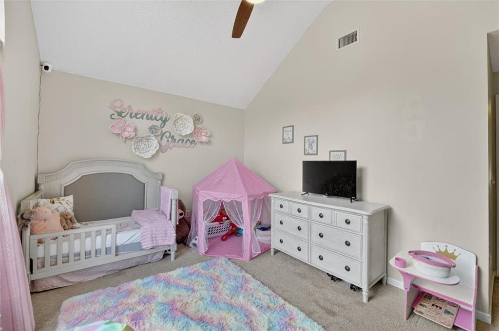 359 Poole Road Ludowici, GA 31316 - Photo 25 of 49 a bedroom with furniture and a flat screen tv