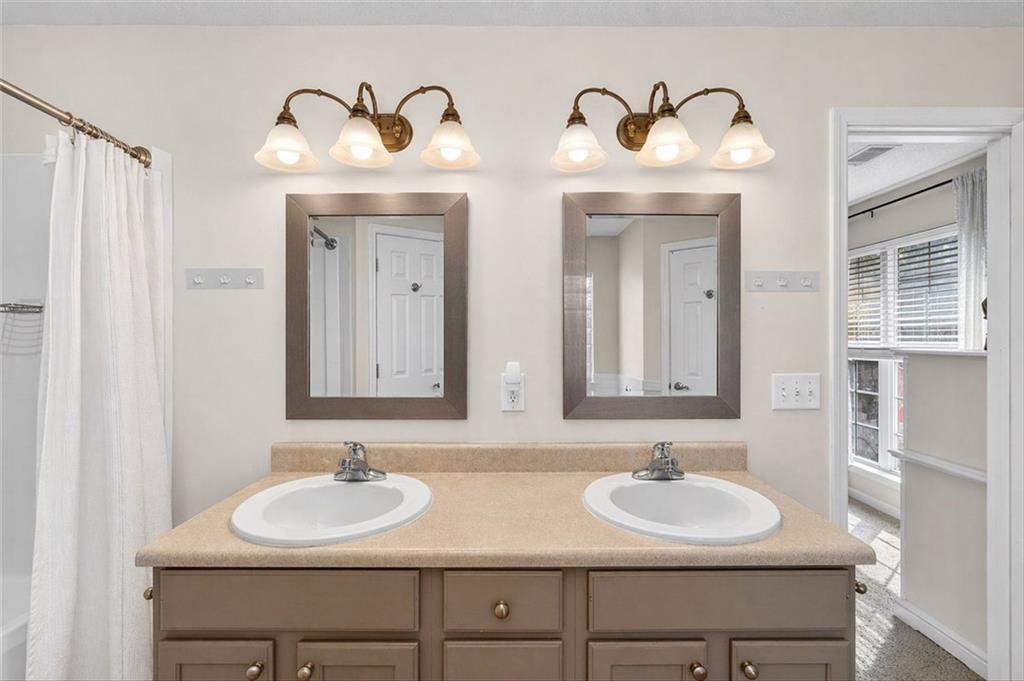 359 Poole Road Ludowici, GA 31316 - Photo 28 of 49 a bathroom with double sink and a mirror