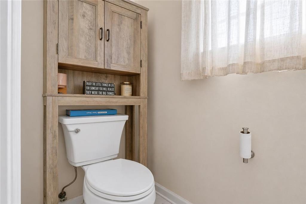 359 Poole Road Ludowici, GA 31316 - Photo 29 of 49 a white toilet sitting next to a bathroom sink