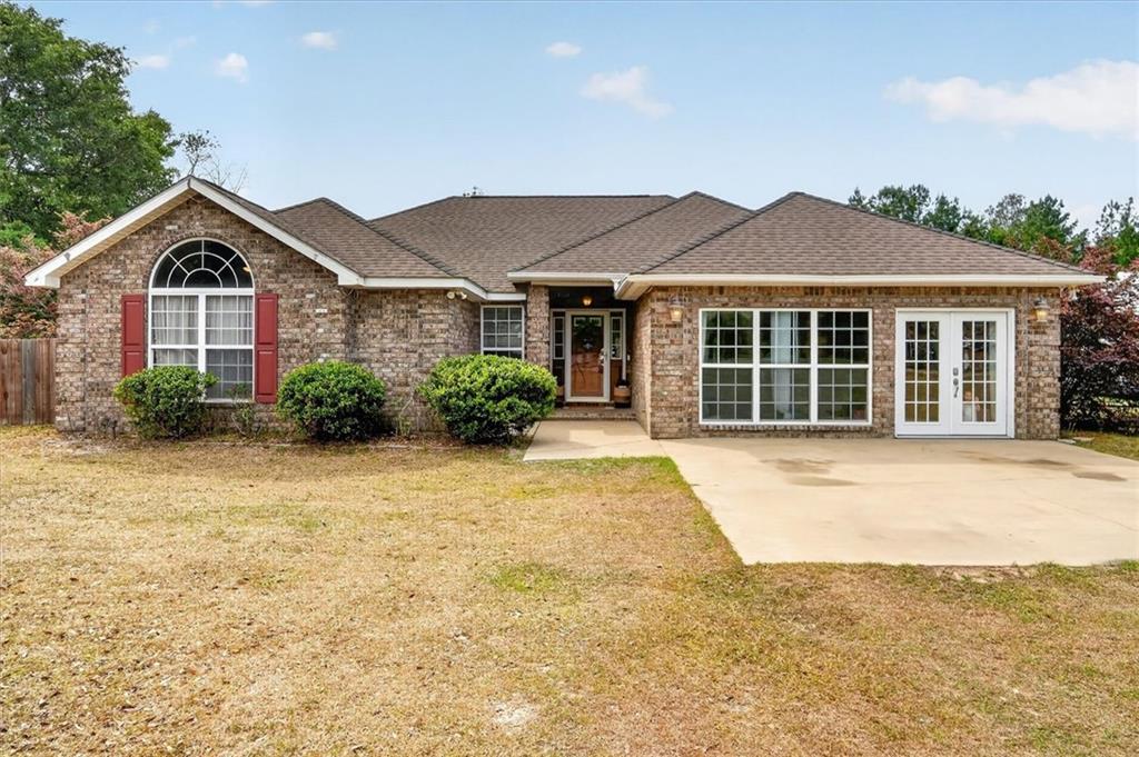 359 Poole Road Ludowici, GA 31316 - Photo 3 of 49 a front view of a house with a yard and garage