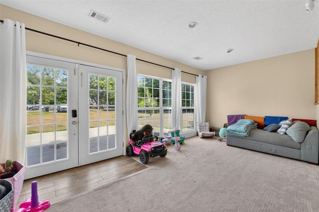 359 Poole Road Ludowici, GA 31316 - Photo 33 of 49 a living room with furniture and large windows