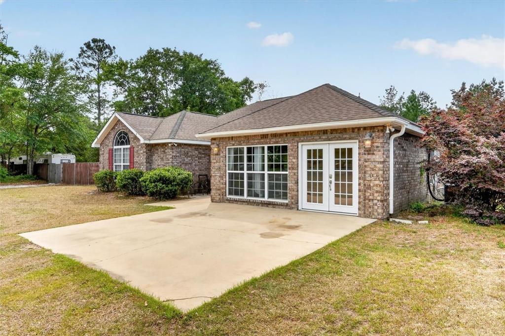 359 Poole Road Ludowici, GA 31316 - Photo 4 of 49 a front view of a house with a yard and garage