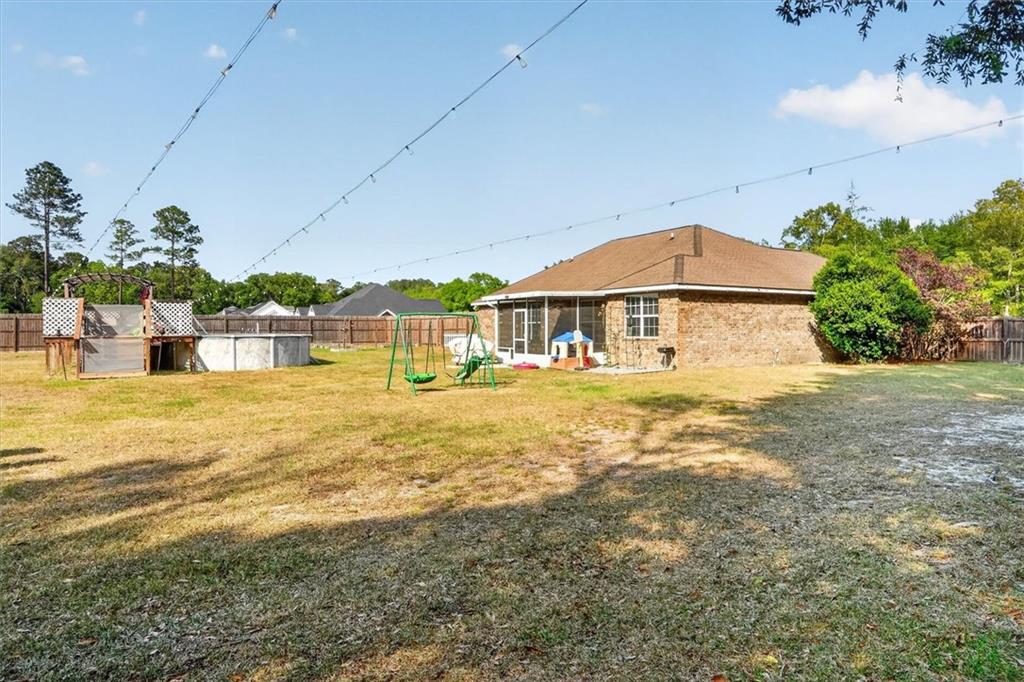 359 Poole Road Ludowici, GA 31316 - Photo 41 of 49 a house view with a swimming pool