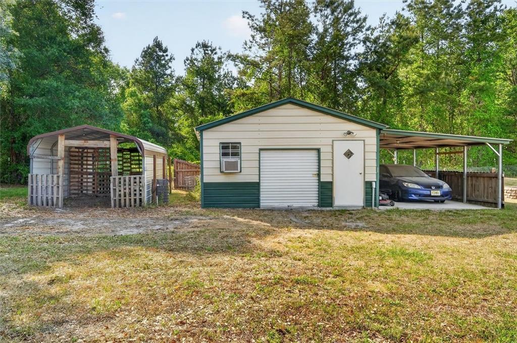359 Poole Road Ludowici, GA 31316 - Photo 44 of 49 a view of a house with backyard and trees
