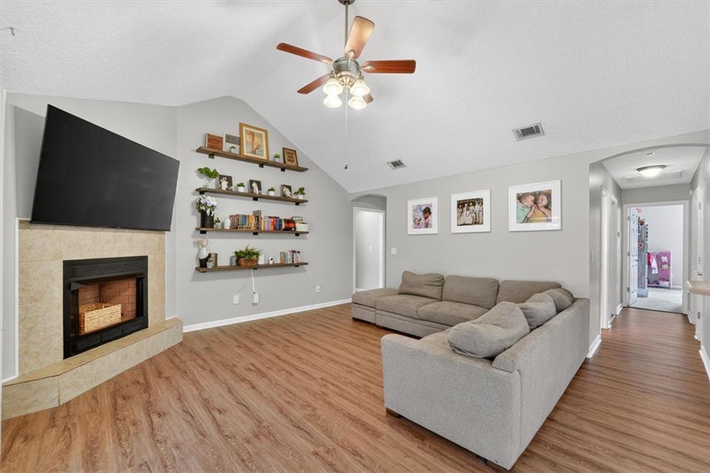 359 Poole Road Ludowici, GA 31316 - Photo 8 of 49 a living room with furniture and a fireplace
